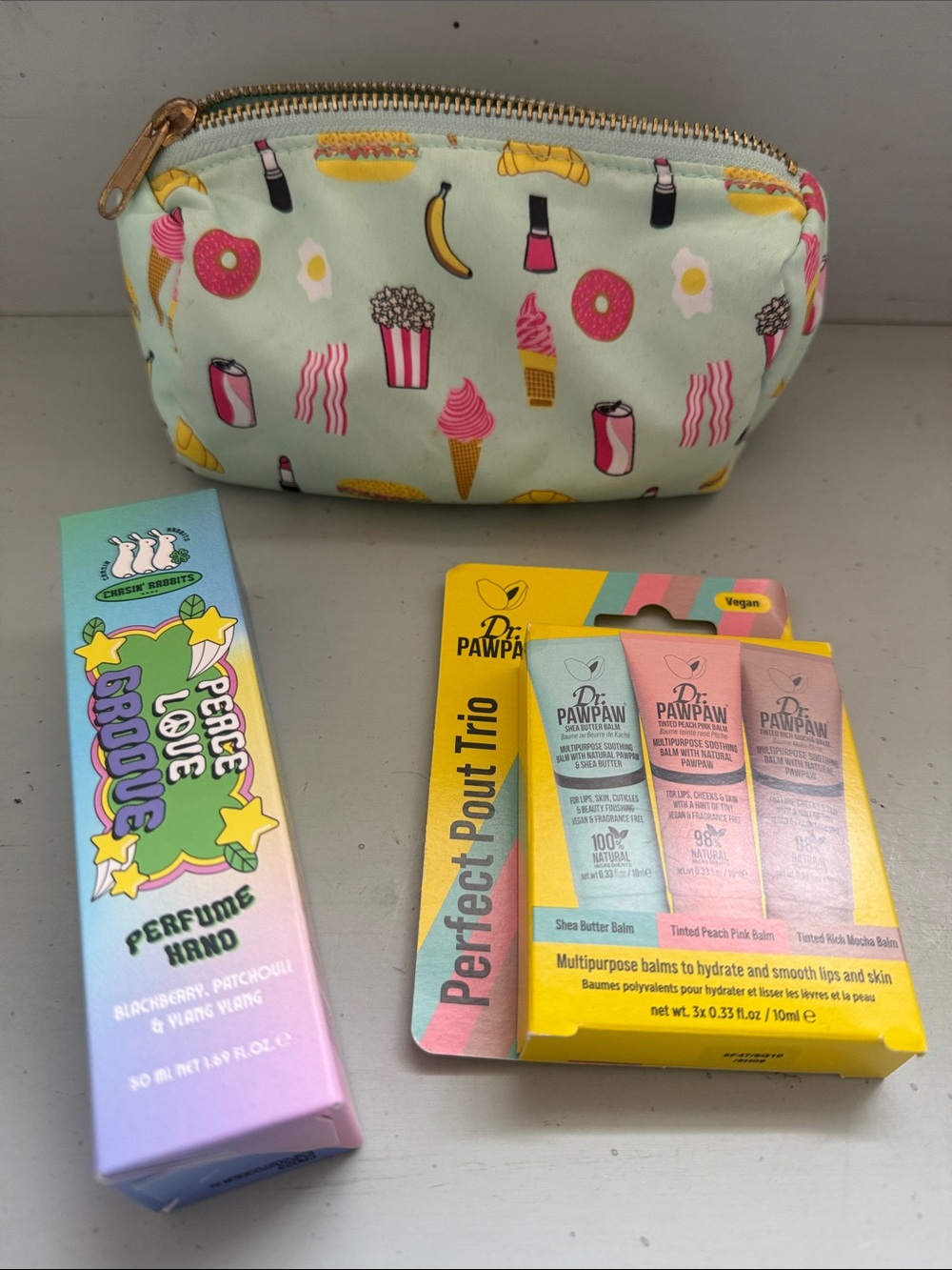 $45 value Bundle Cosmetic Pouch with lip balms and chasing rabbits hand cream